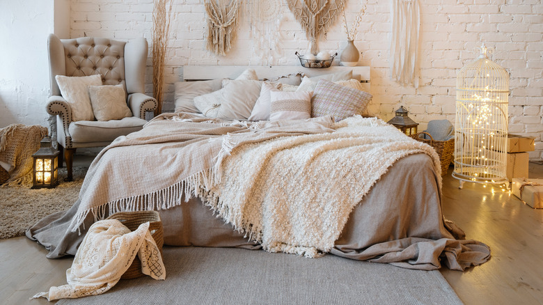 bohemian bed with layered blankets