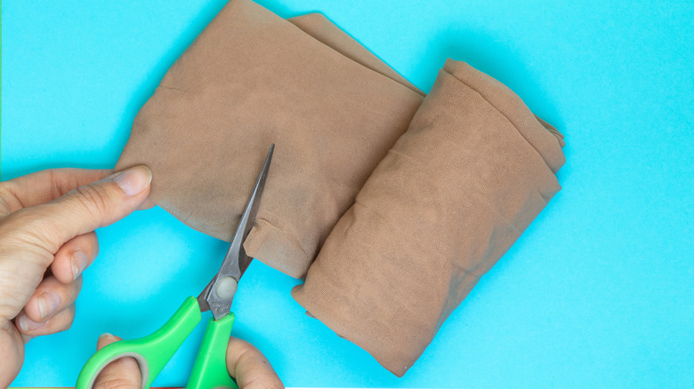 cutting pantyhose with sharp scissors