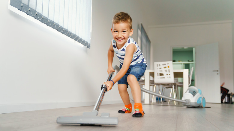 little kid with mop