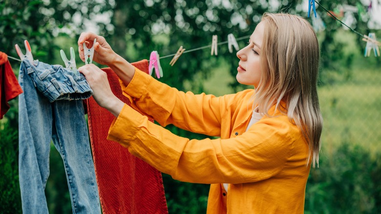 Person hanging clothes to dry