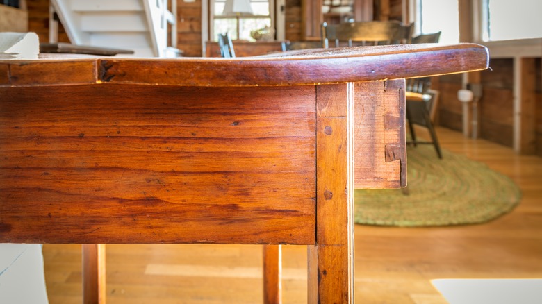 Damaged table with dovetails