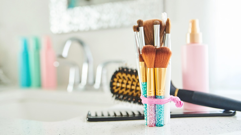 cluttered bathroom countertop