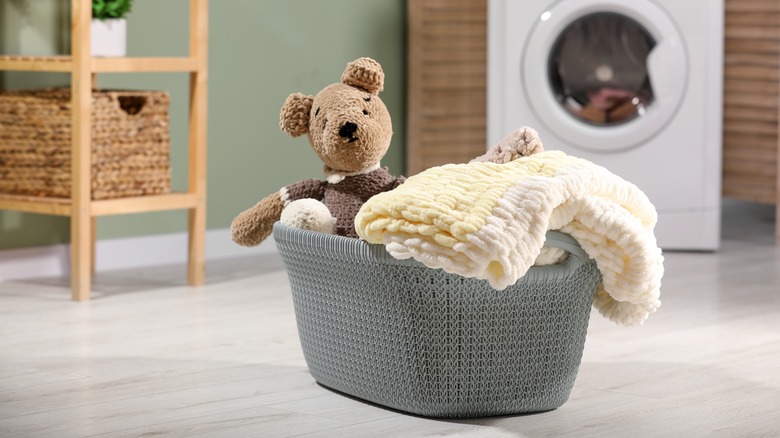 Plush bear in laundry basket