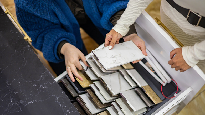 people picking tile samples