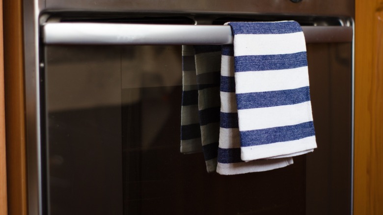 https://www.housedigest.com/img/gallery/the-kitchen-item-that-can-save-your-towels-from-the-floor/intro-1698335458.jpg