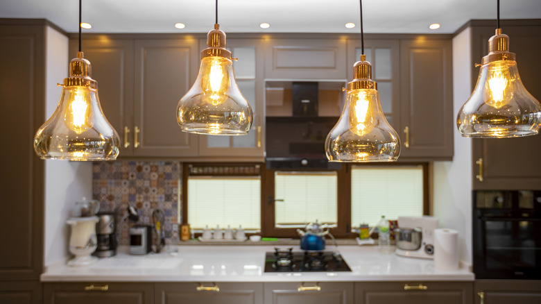 Kitchen with recessed lights and pendant lighting