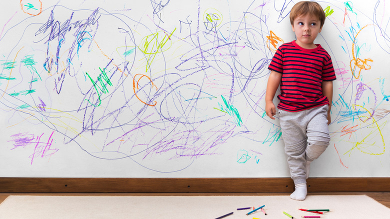 child's drawings on white wall