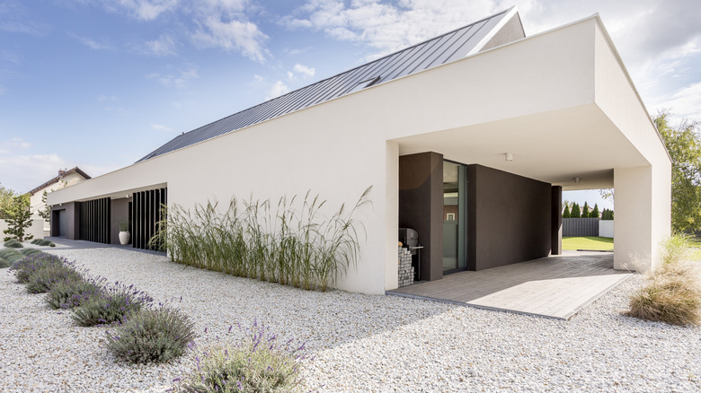 A house surrounded by gravel