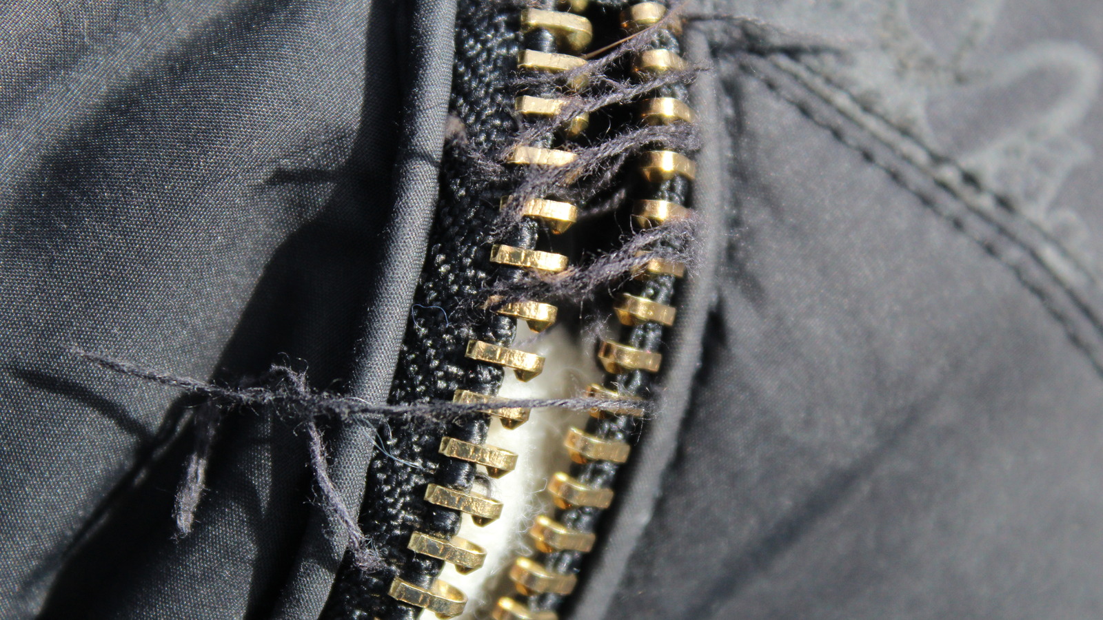 The Laundry Mistake That's Damaging The Zippers On Your Clothing