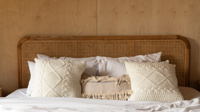 bed with rattan headboard