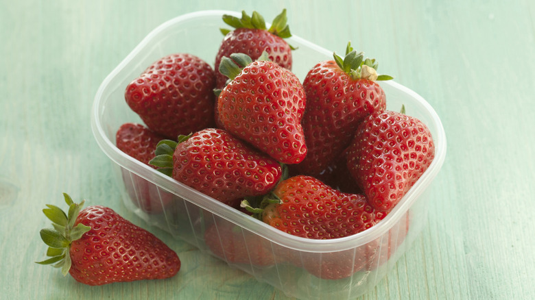 plastic container with strawberries