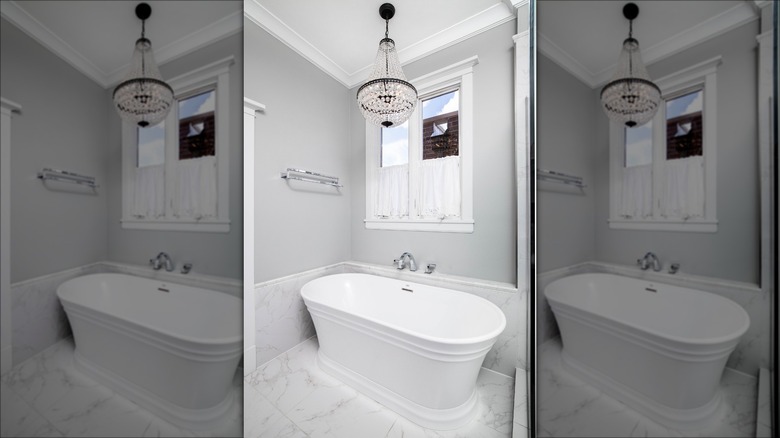 cyrstal chandelier above bathtub