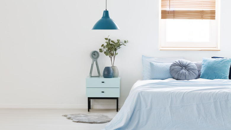 Bedroom with blue pendant light