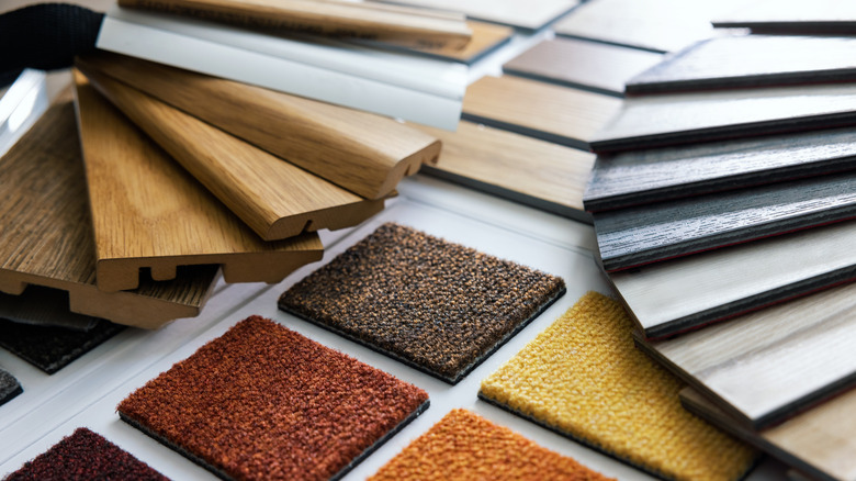 Samples of wood and carpet flooring options