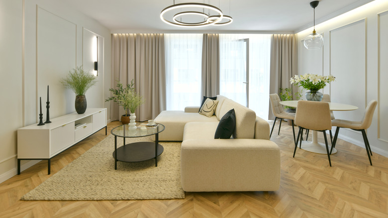 Living room with herringbone hardwood floor planks