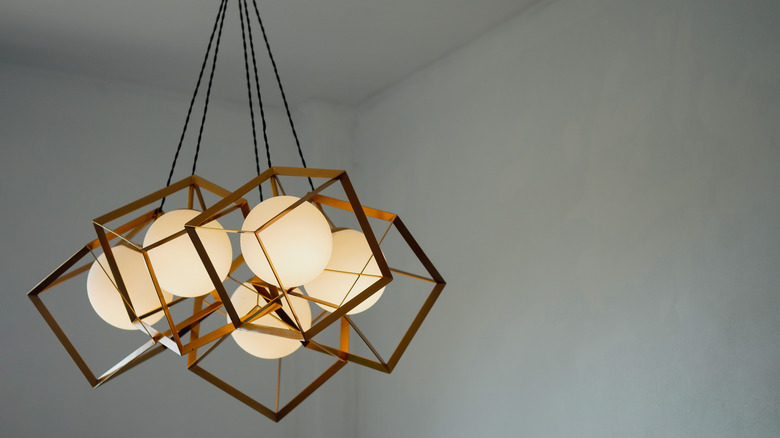 Round cluster lighting in a cast iron frame