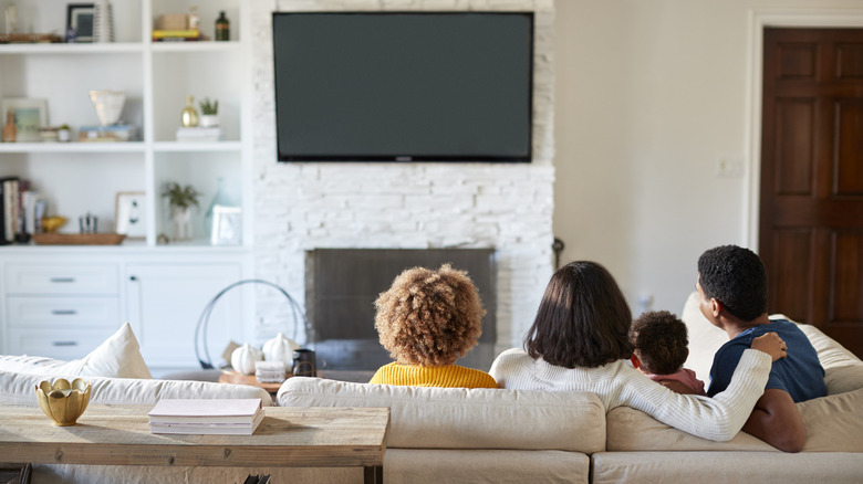 Family on sofa in family room