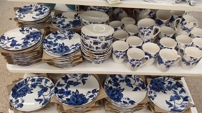 A blue floral stoneware collection from Royal Norfolk on shelves at Dollar Tree.