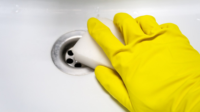 Cleaning drain with a sponge