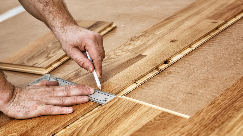 person fitting in wooding floors