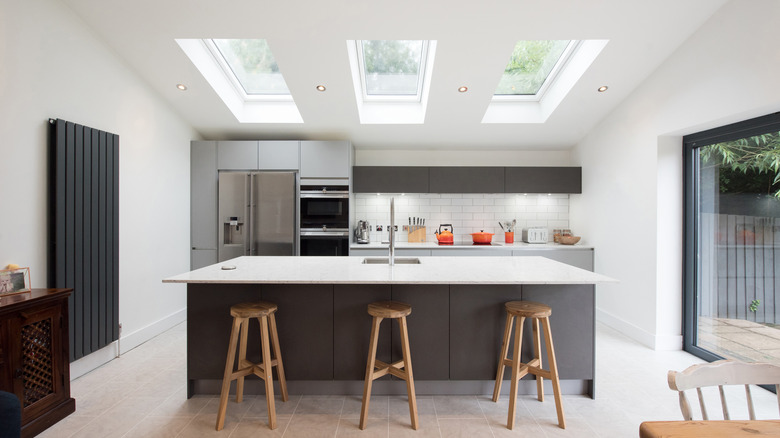 Three skylights above a kitchen island