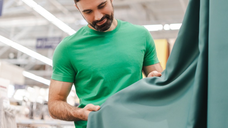 Man shopping for curtains