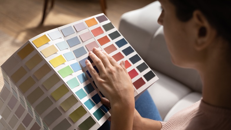 woman choosing paint colors