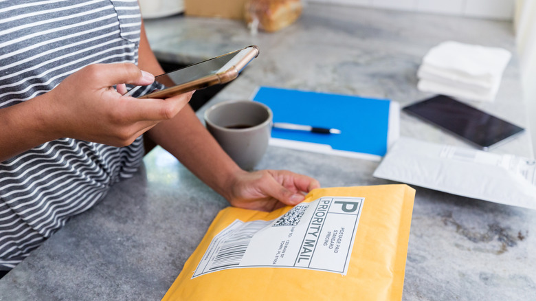 Person preparing a mailing package