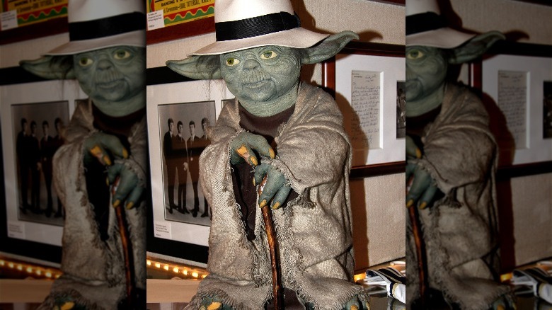 Yoda statue wearing a fedora