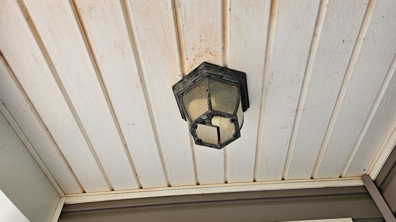 light hanging from a porch ceiling