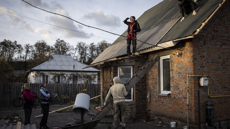 team rebuilding a roof 