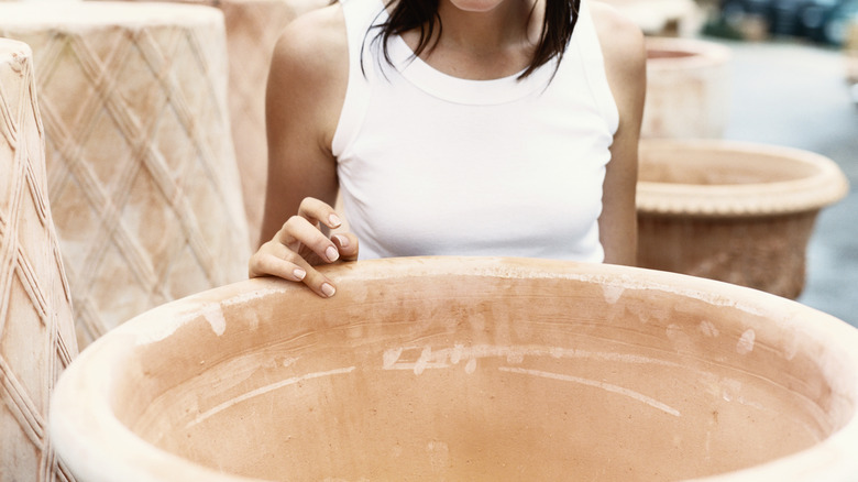 woman looking into huge pot