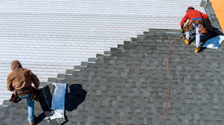 workers installing new roof 