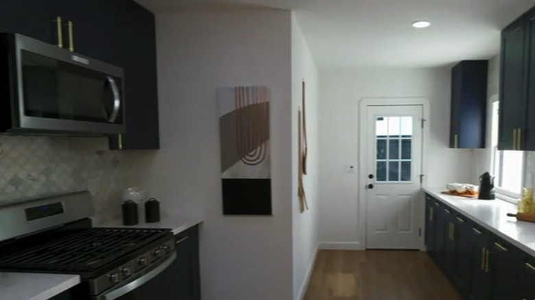 Kitchen with dark blue cabinets 