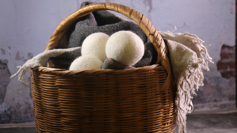 full laundry basket of dryer balls
