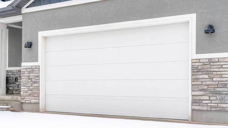 garage doors gray suburban house