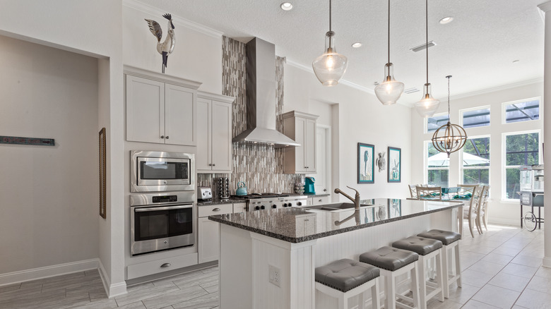 Large gray-and-white kitchen, window wall