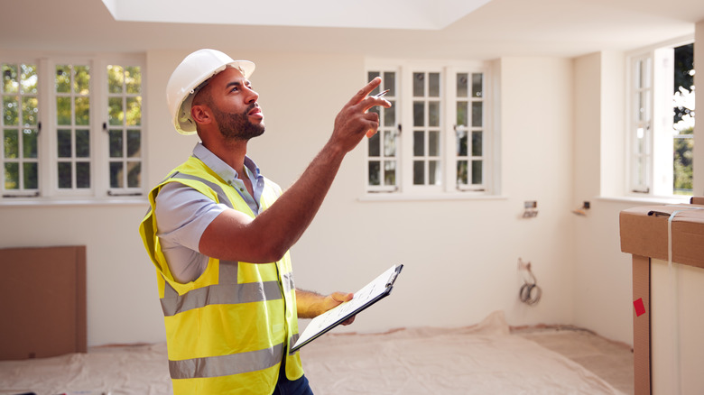 man performing house inspection