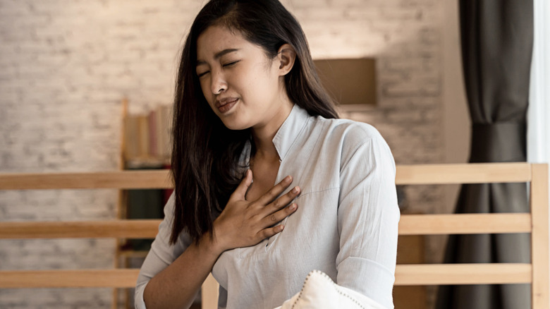 woman having difficulty breathing