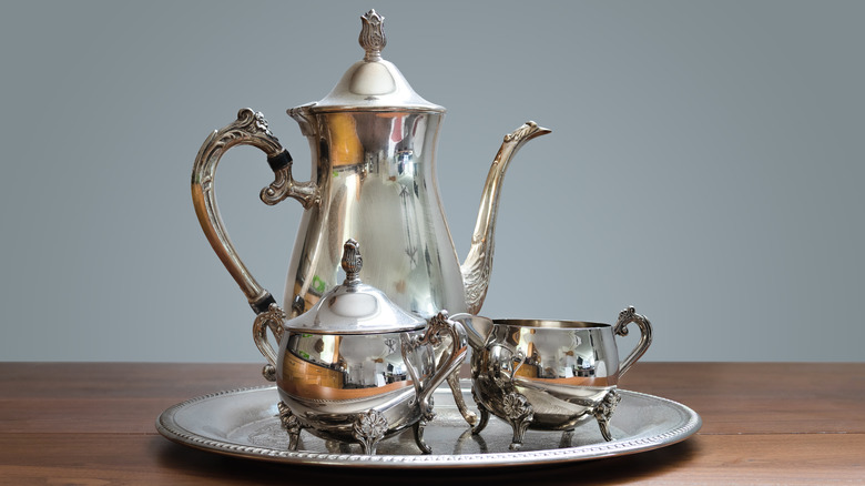 silver tea kettle on tray