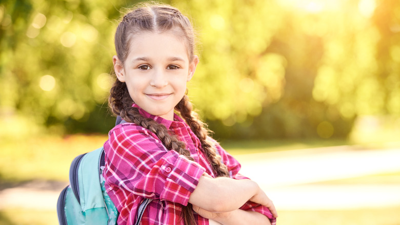 Young girl wearing a backpack