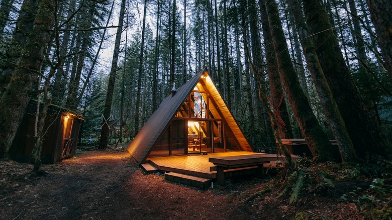 a frame cabin at night