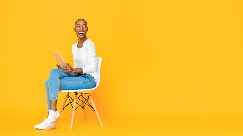 Person sitting in yellow room