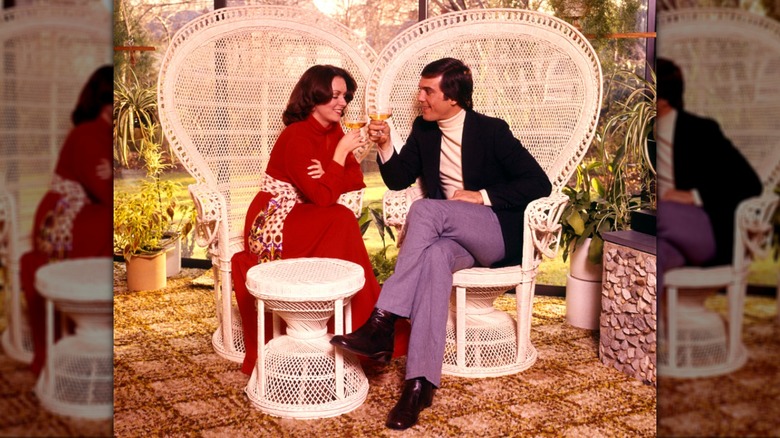 1970s couple on rattan chairs