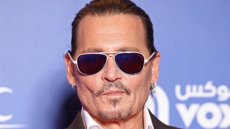 Johnny Depp poses at film premiere