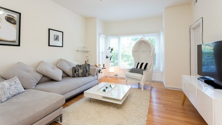 white living room with gray couch