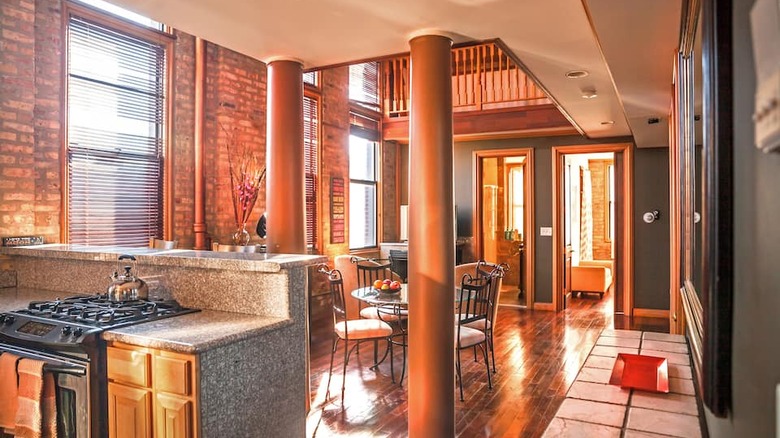 dining area with brick walls 