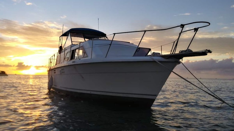 yacht in the ocean at sunset