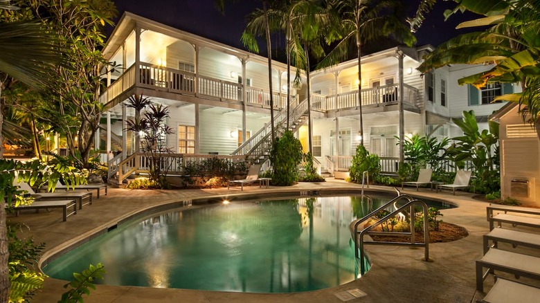 white wooden house with pool