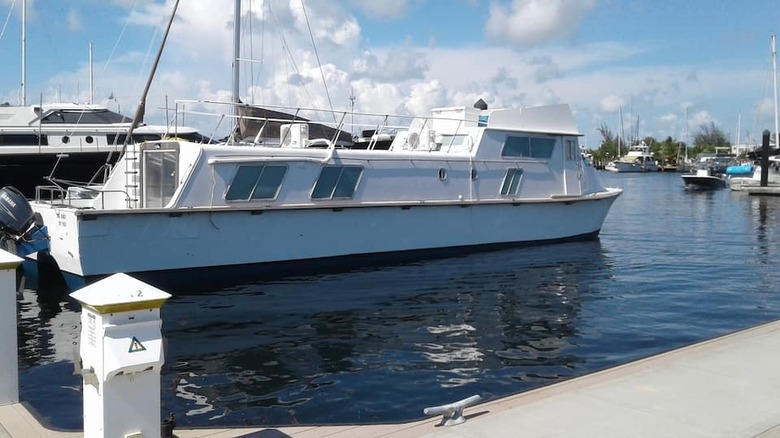 white and blue yacht 